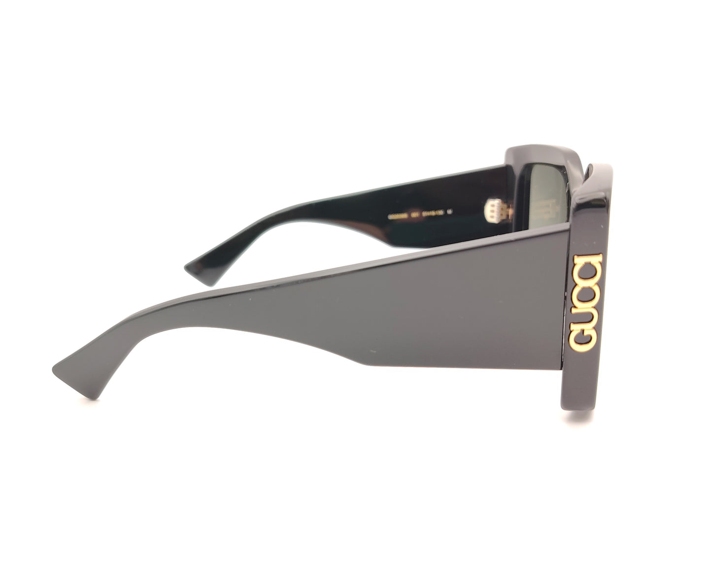 gafas de sol gucci negras oversize cuadradas con logo dorado lateral