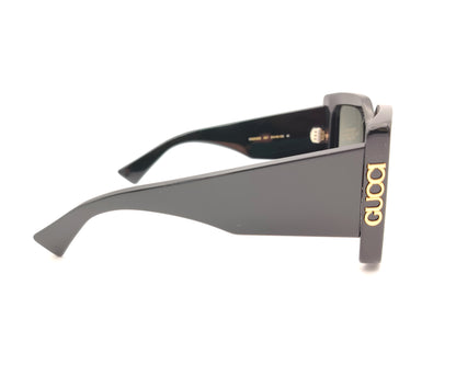 gafas de sol gucci negras oversize cuadradas con logo dorado lateral