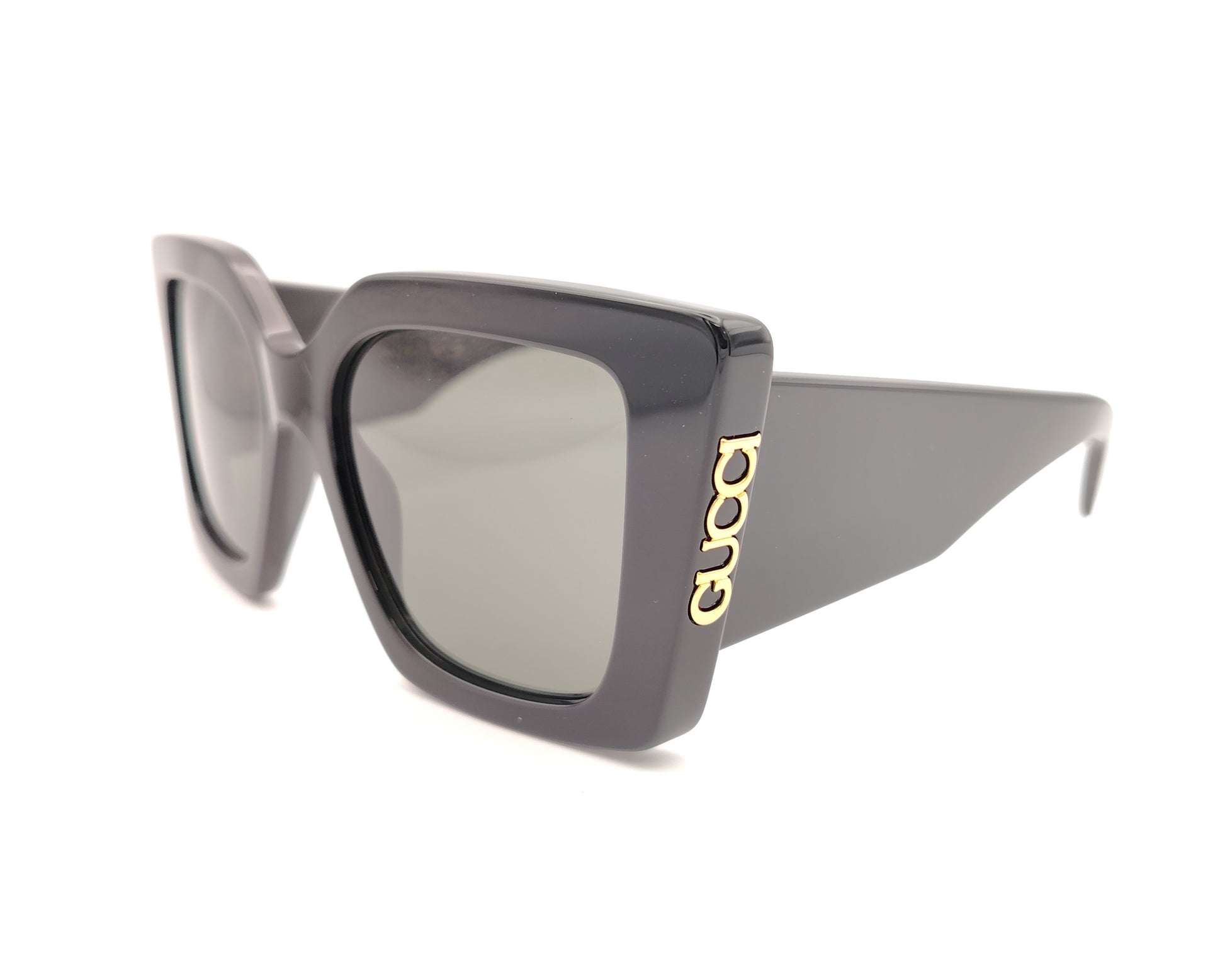 gafas de sol gucci negras oversize cuadradas con logo dorado lateral