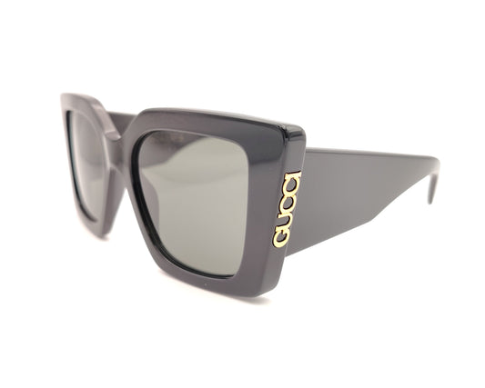 gafas de sol gucci negras oversize cuadradas con logo dorado lateral