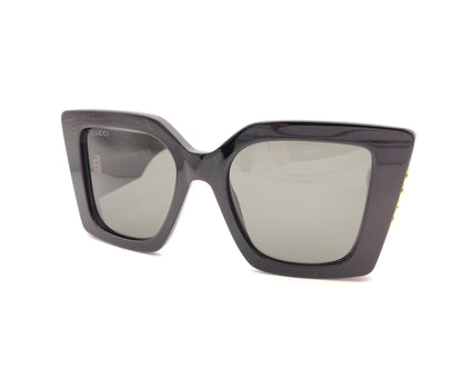 gafas de sol gucci negras oversize cuadradas con logo dorado lateral