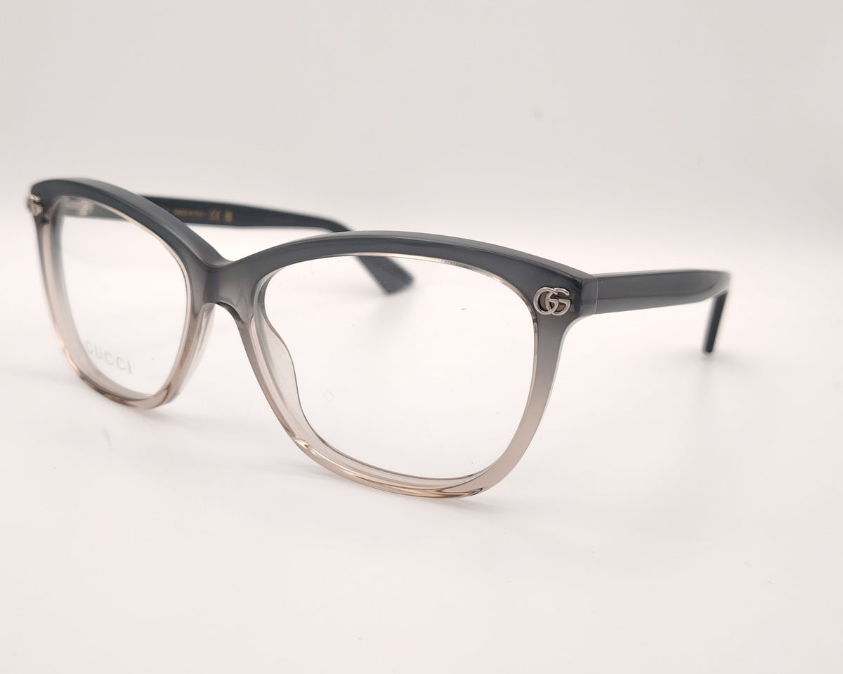 gafas gucci graduadas con montura degradada gris humo y transparente y detalle gg metálico