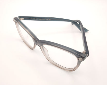 gafas gucci graduadas con montura degradada gris humo y transparente y detalle gg metálico