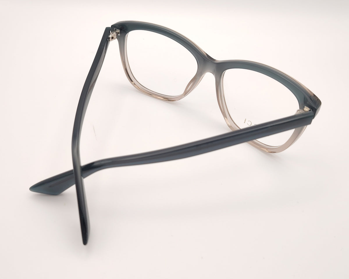 gafas gucci graduadas con montura degradada gris humo y transparente y detalle gg metálico