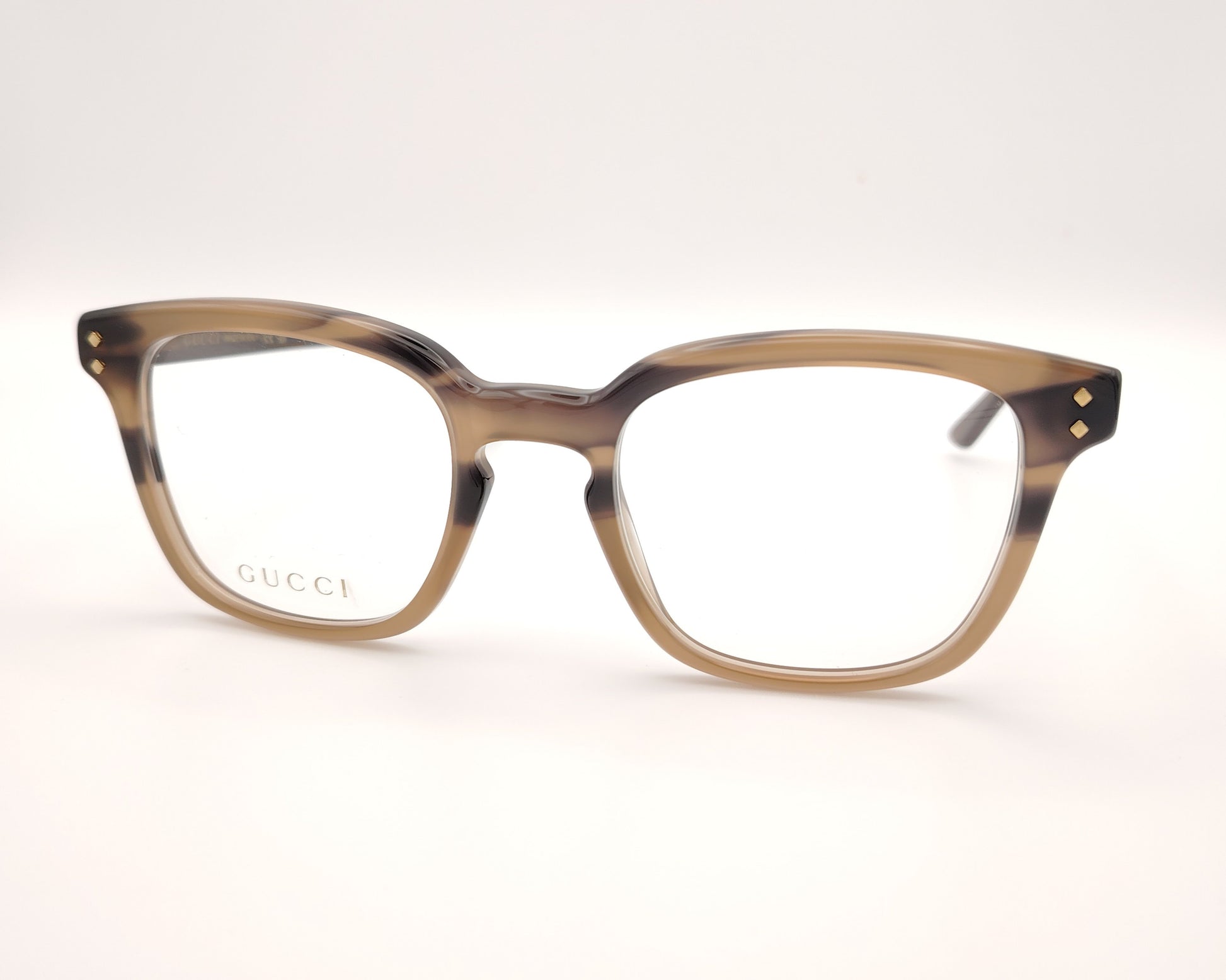 gafas gucci graduadas con montura carey marrón claro y detalles dorados en el frontal y la varilla