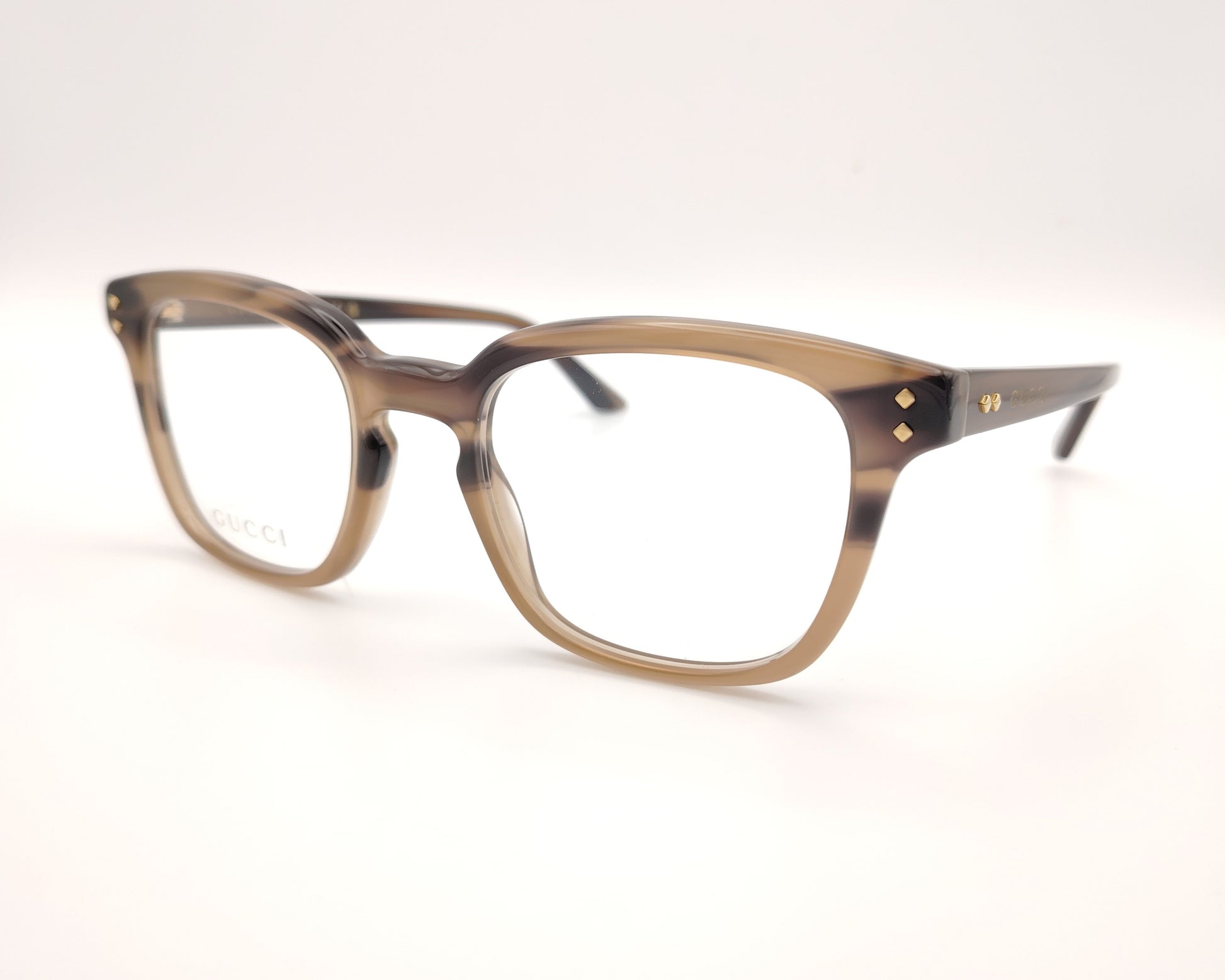 gafas gucci graduadas con montura carey marrón claro y detalles dorados en el frontal y la varilla