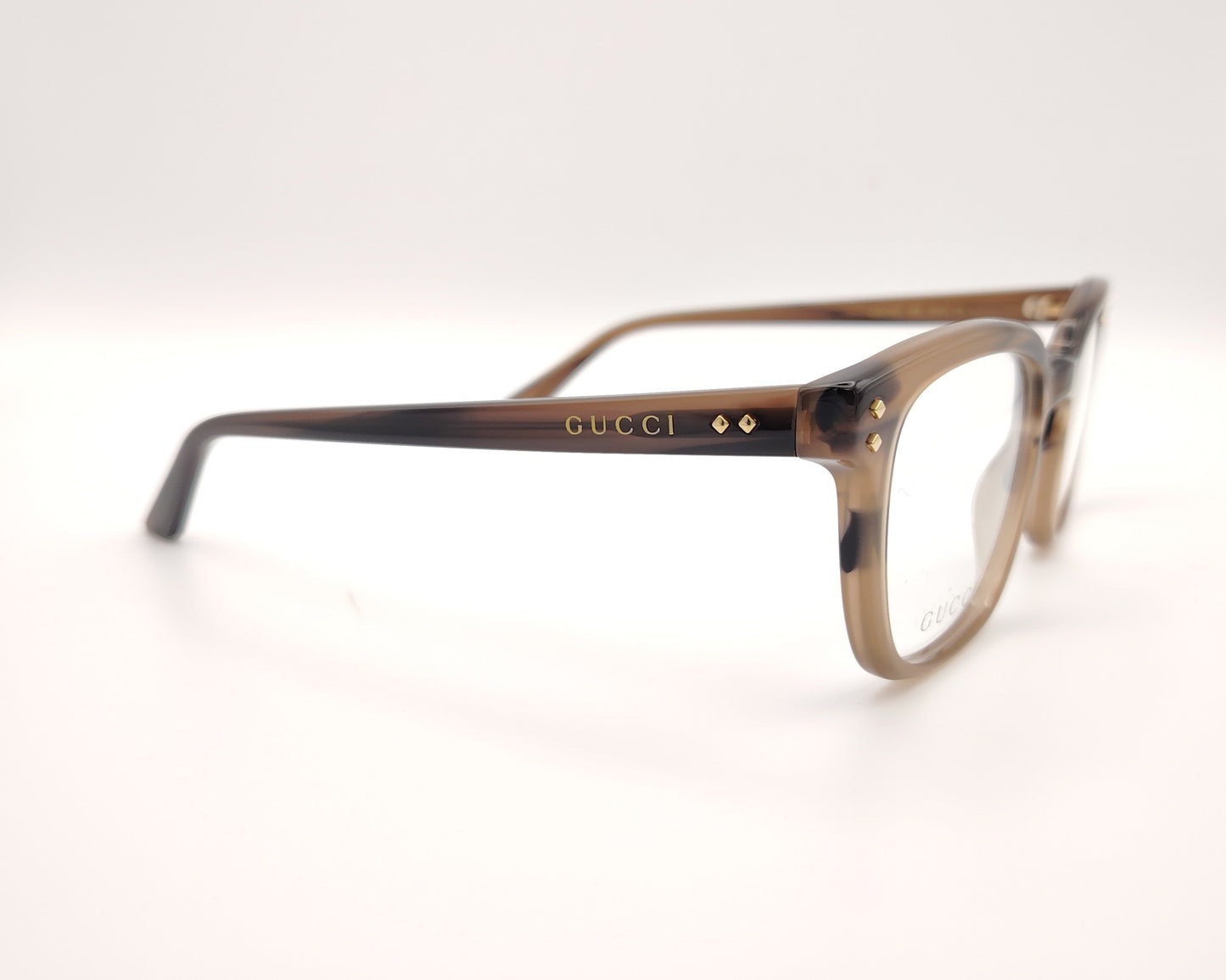 gafas gucci graduadas con montura carey marrón claro y detalles dorados en el frontal y la varilla