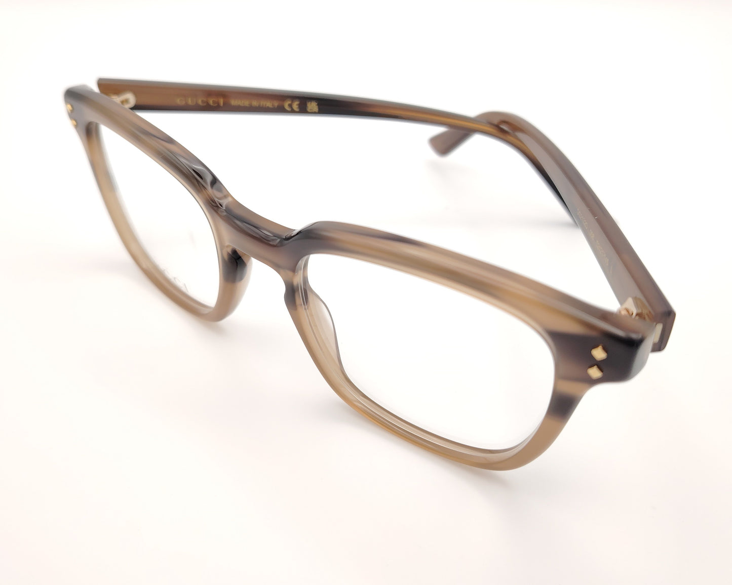 gafas gucci graduadas con montura carey marrón claro y detalles dorados en el frontal y la varilla