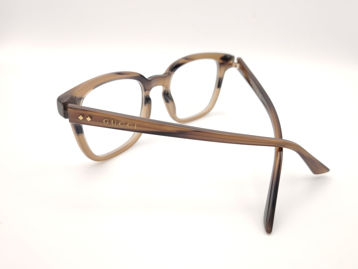 gafas gucci graduadas con montura carey marrón claro y detalles dorados en el frontal y la varilla