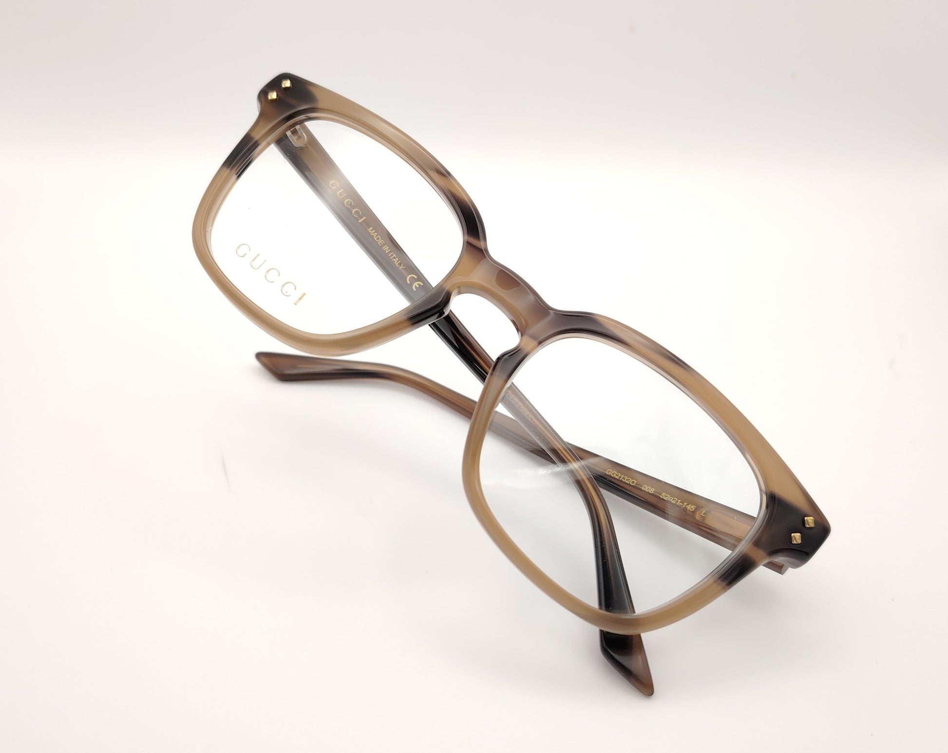 gafas gucci graduadas con montura carey marrón claro y detalles dorados en el frontal y la varilla
