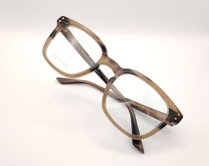 gafas gucci graduadas con montura carey marrón claro y detalles dorados en el frontal y la varilla
