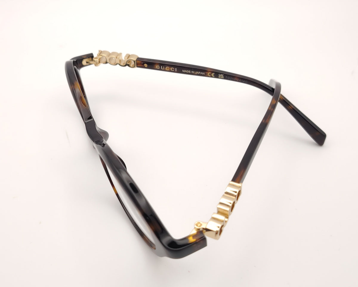 gafas gucci graduadas redondas de acetato carey con logo dorado en las varillas