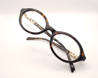 gafas gucci graduadas redondas de acetato carey con logo dorado en las varillas