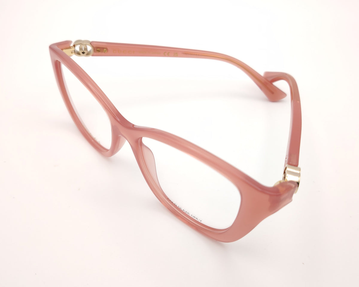 gafas gucci graduadas rosas translúcidas con forma cat eye y detalle gg dorado