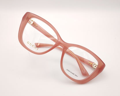 gafas gucci graduadas rosas translúcidas con forma cat eye y detalle gg dorado