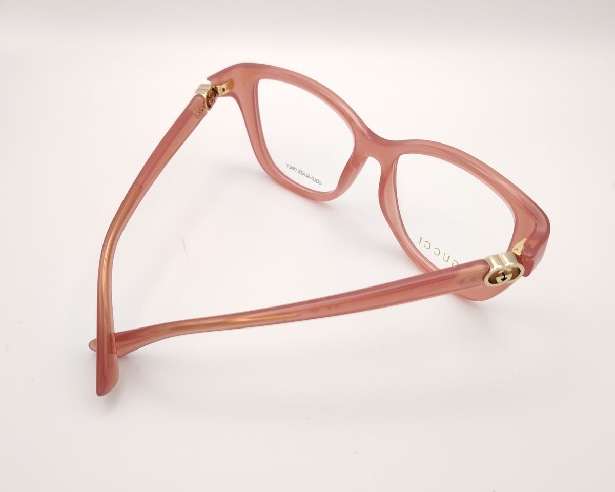 gafas gucci graduadas rosas translúcidas con forma cat eye y detalle gg dorado