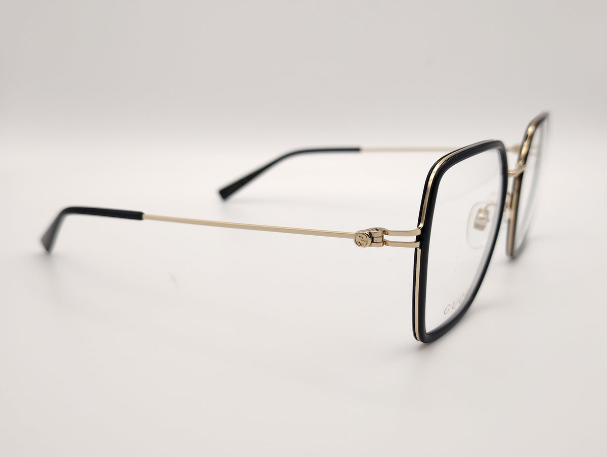 gafas gucci cuadradas con estructura metálica dorada y borde negro brillante