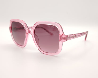 gafas de sol guess rosas translúcidas con lentes malva degradadas y corazones en la varilla
