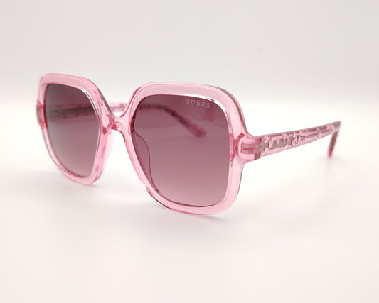 gafas de sol guess rosas translúcidas con lentes malva degradadas y corazones en la varilla