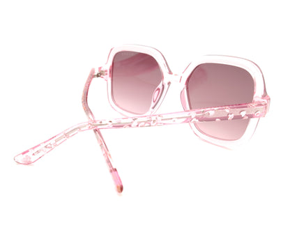 gafas de sol guess rosas translúcidas con lentes malva degradadas y corazones en la varilla