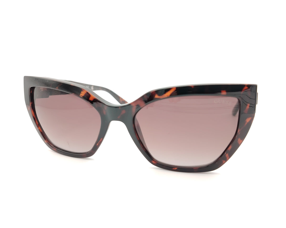 gafas guess carey oscuro con lentes rosas degradadas y detalle geometrico en la varilla