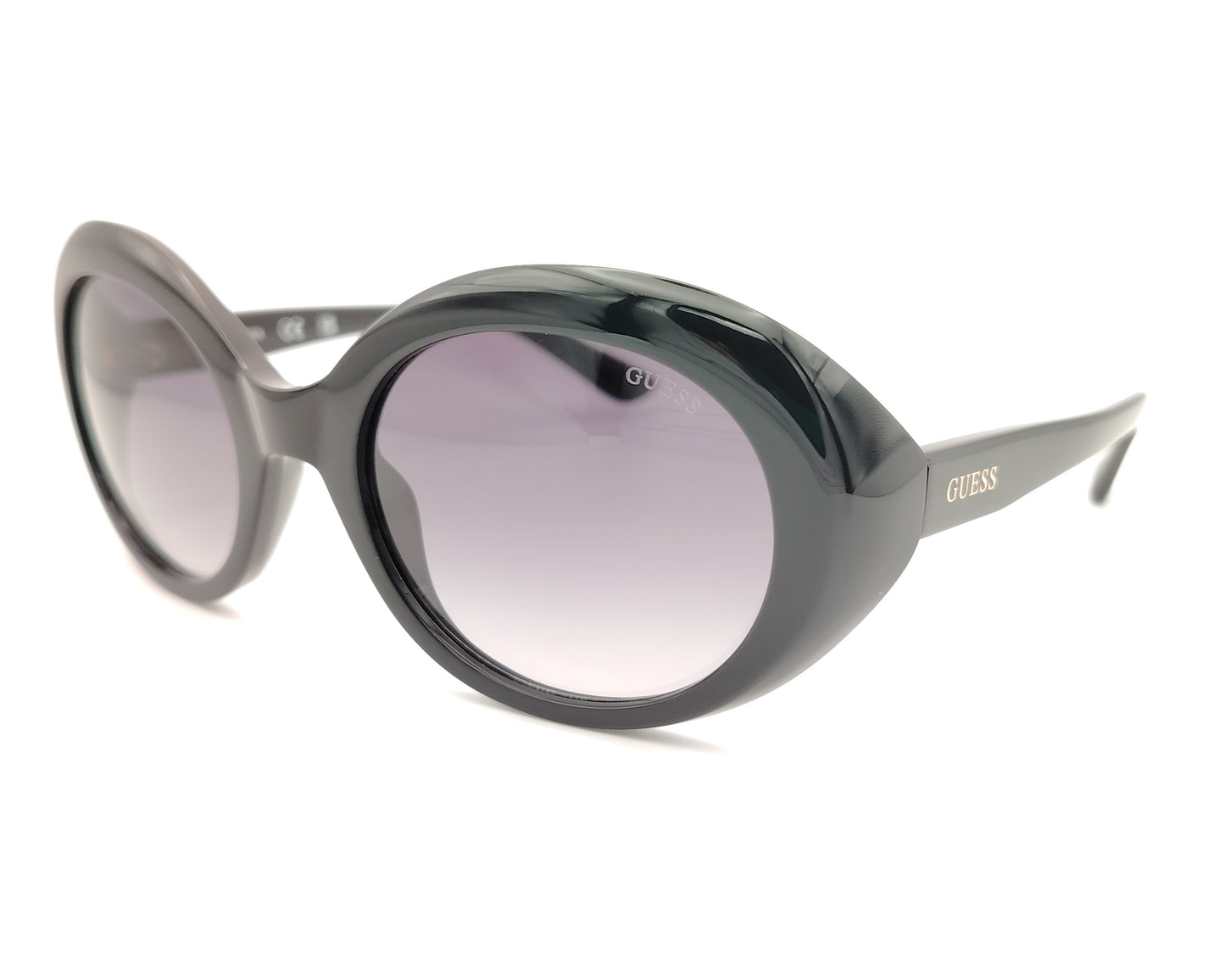 gafas guess negras ovaladas con lentes gris violáceo degradadas y logo dorado en la patilla