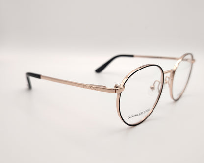 gafas de vista guess con montura redonda de metal dorado con el perfil de los aros en negro