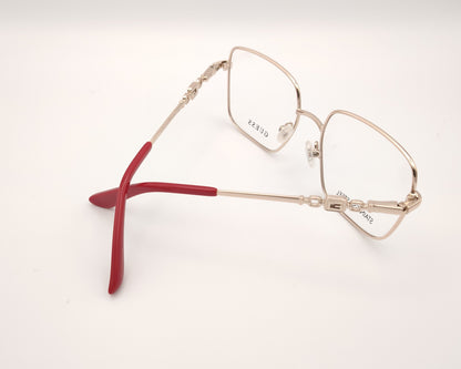 gafas graduadas guess de acero inoxidable doradas con forma cuadrada y terminales rojos