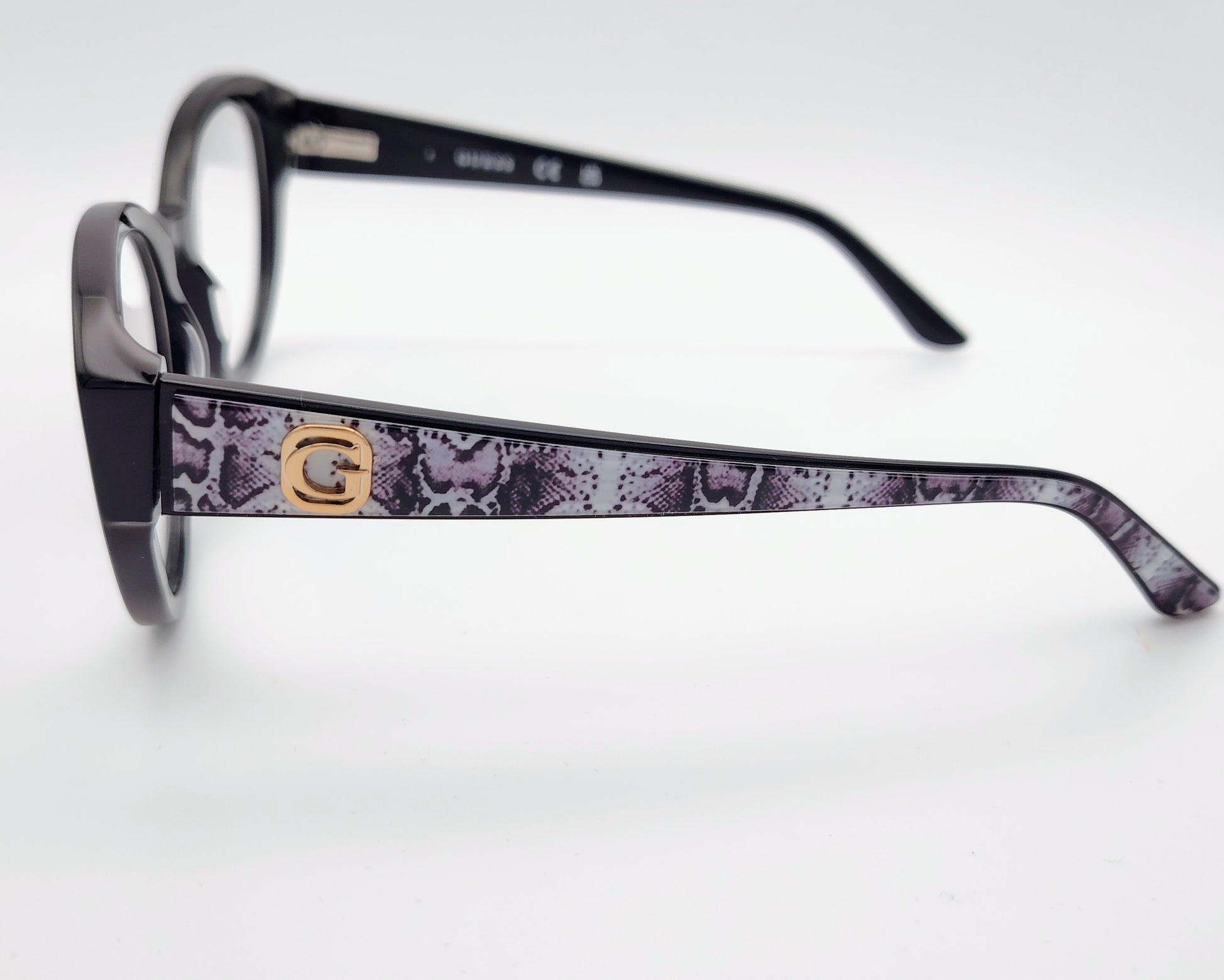guess gu50127 001 gafas estilo cat eyes redondeadas de acetato en color negro con las varillas en estampado de serpiente gris