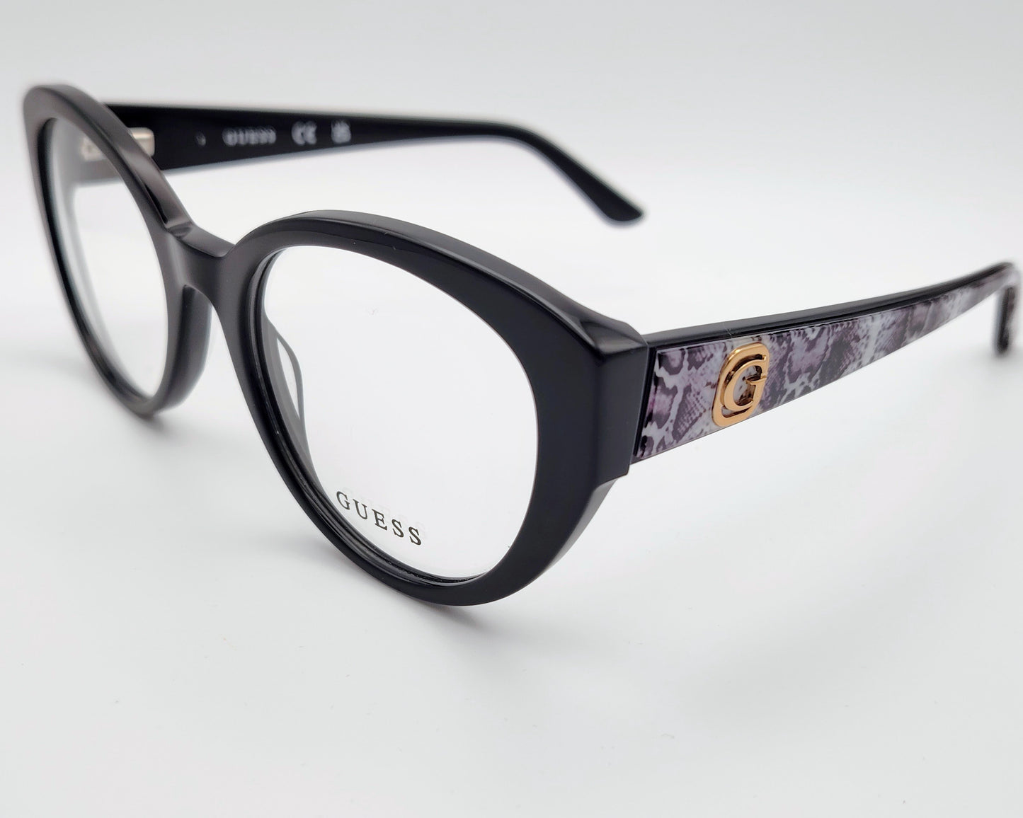 guess gu50127 001 gafas estilo cat eyes redondeadas de acetato en color negro con las varillas en estampado de serpiente gris