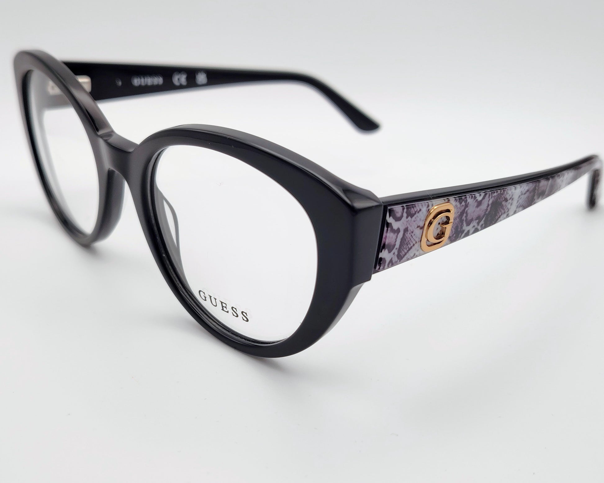 guess gu50127 001 gafas estilo cat eyes redondeadas de acetato en color negro con las varillas en estampado de serpiente gris
