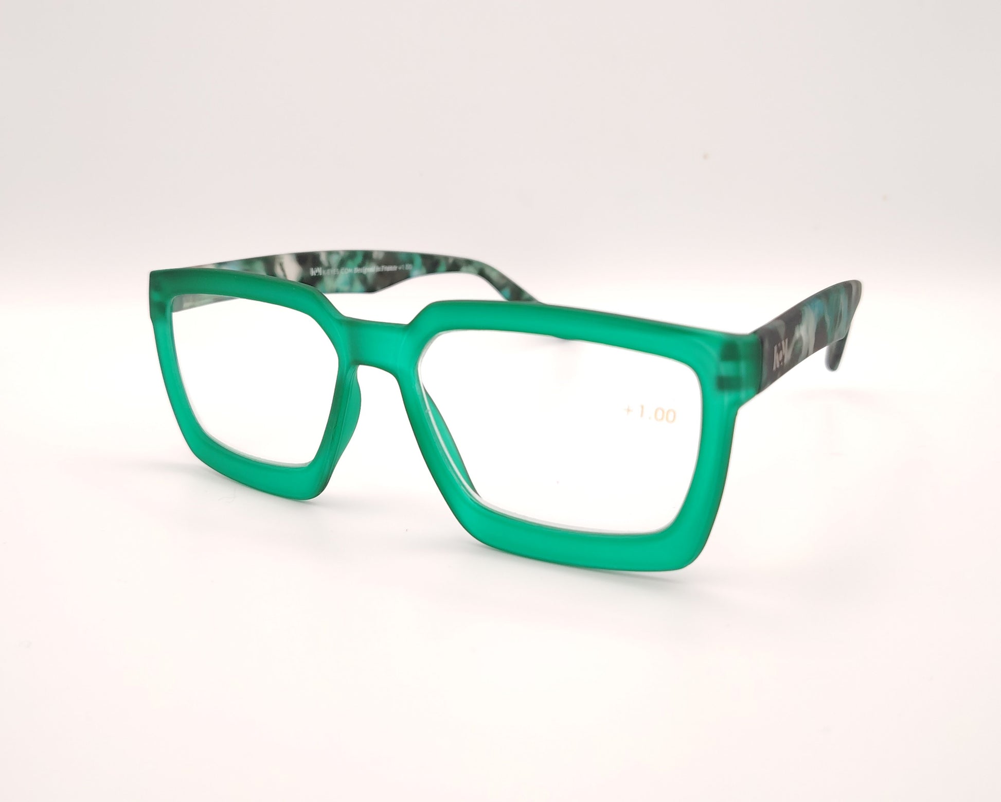 gafas de lectura rectangulares con frontal verde translúcido y patillas con estampado mármol en tonos verdes
