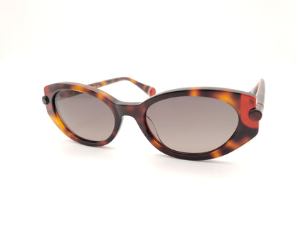 gafas de sol le parc klein 02 carey en tonos marrón, ámbar y rojo con forma ovalada retro