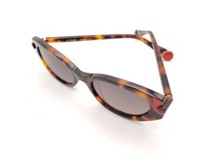 gafas de sol le parc klein 02 carey en tonos marrón, ámbar y rojo con forma ovalada retro