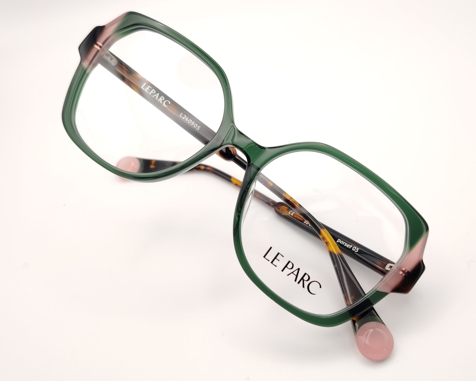 gafas le parc porset 03, montura de acetato en tonos verde y rosa, diseño cuadrado con bordes suaves, estilo elegante y contemporáneo