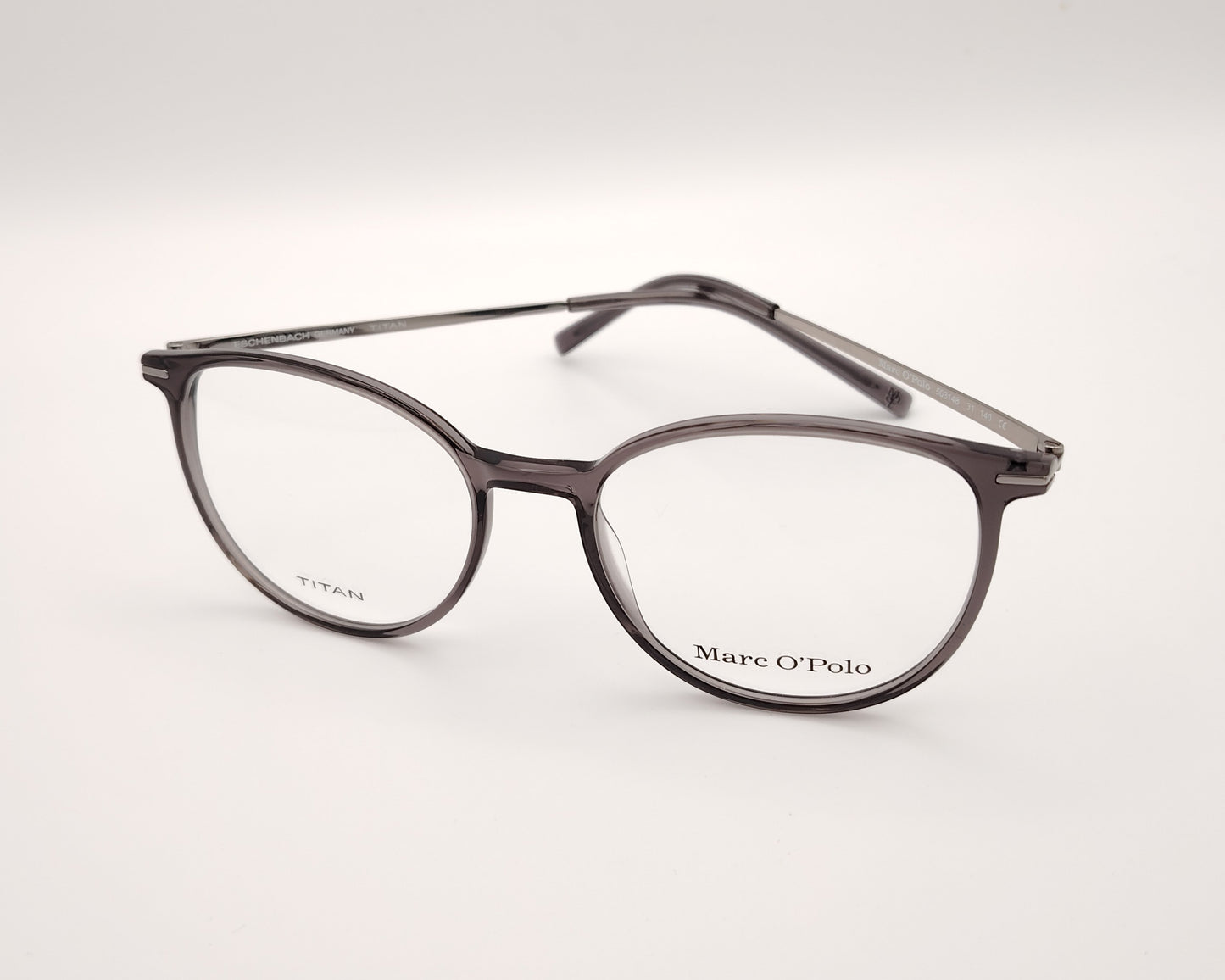 gafas marc o´polo de pasta redonda en color gris traslúcido con varillas de metal