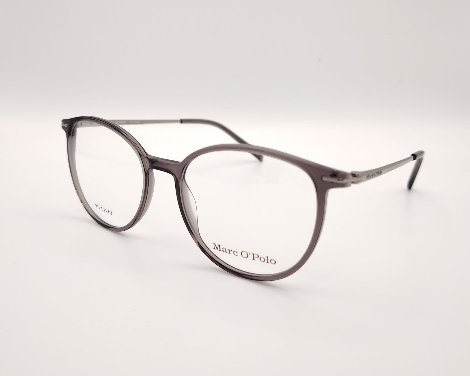 gafas marc o´polo de pasta redonda en color gris traslúcido con varillas de metal