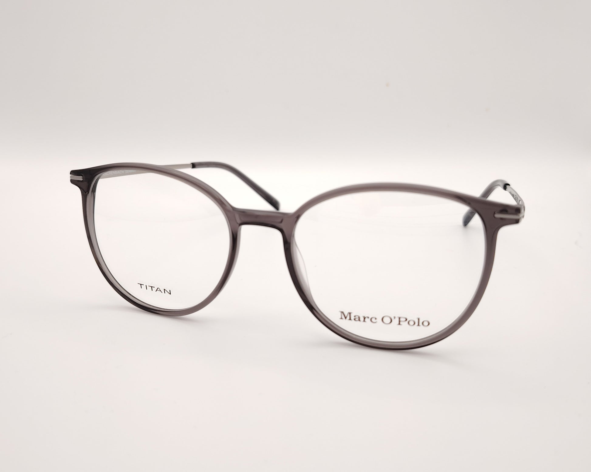 gafas marc o´polo de pasta redonda en color gris traslúcido con varillas de metal