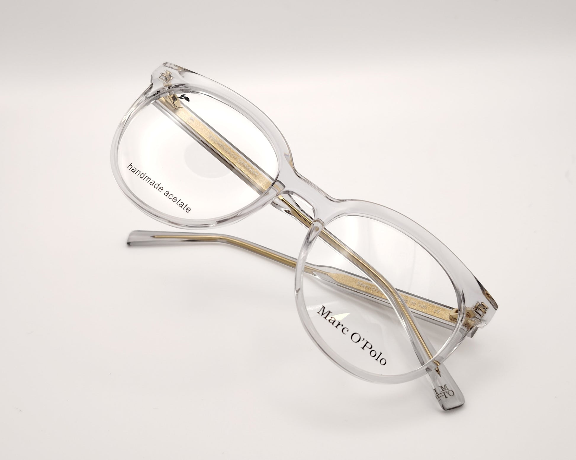 gafas graduadas marc o polo de forma redondeada en acetato transparente con varillas metálicas doradas