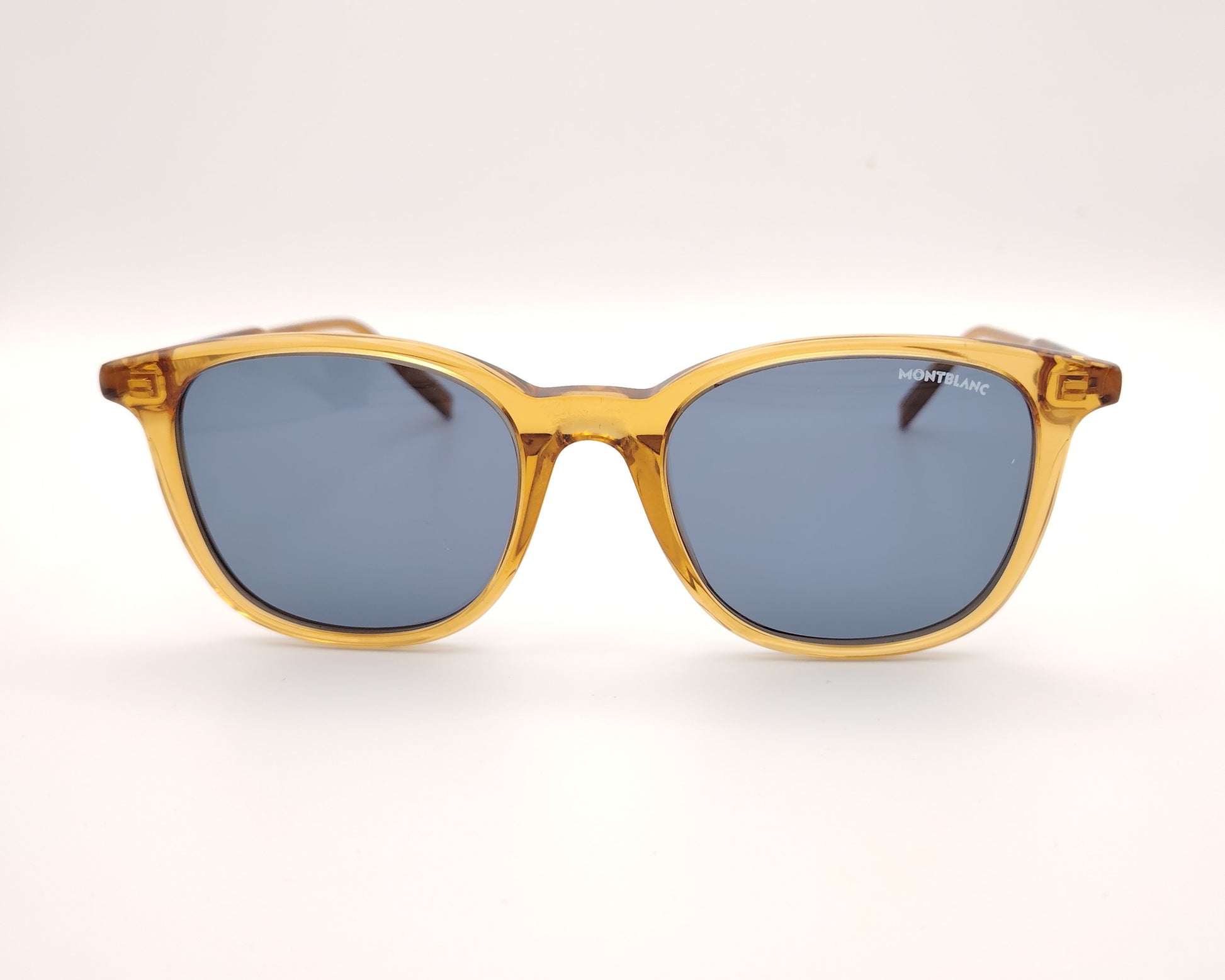 gafas de sol montblanc color ámbar con lentes azules oscuras y montura translúcida
