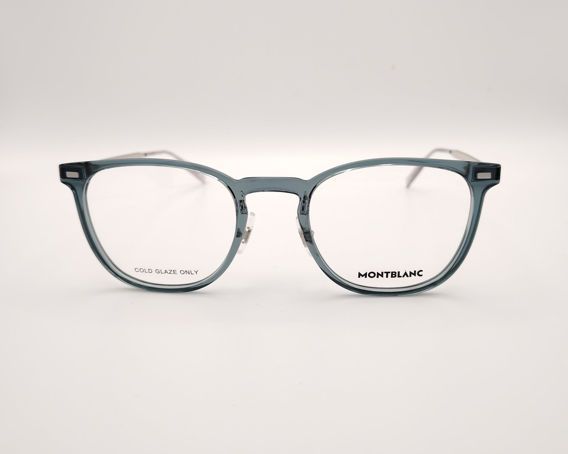 gafas montblanc con montura azul translúcida rectangular y varillas metálicas en plata