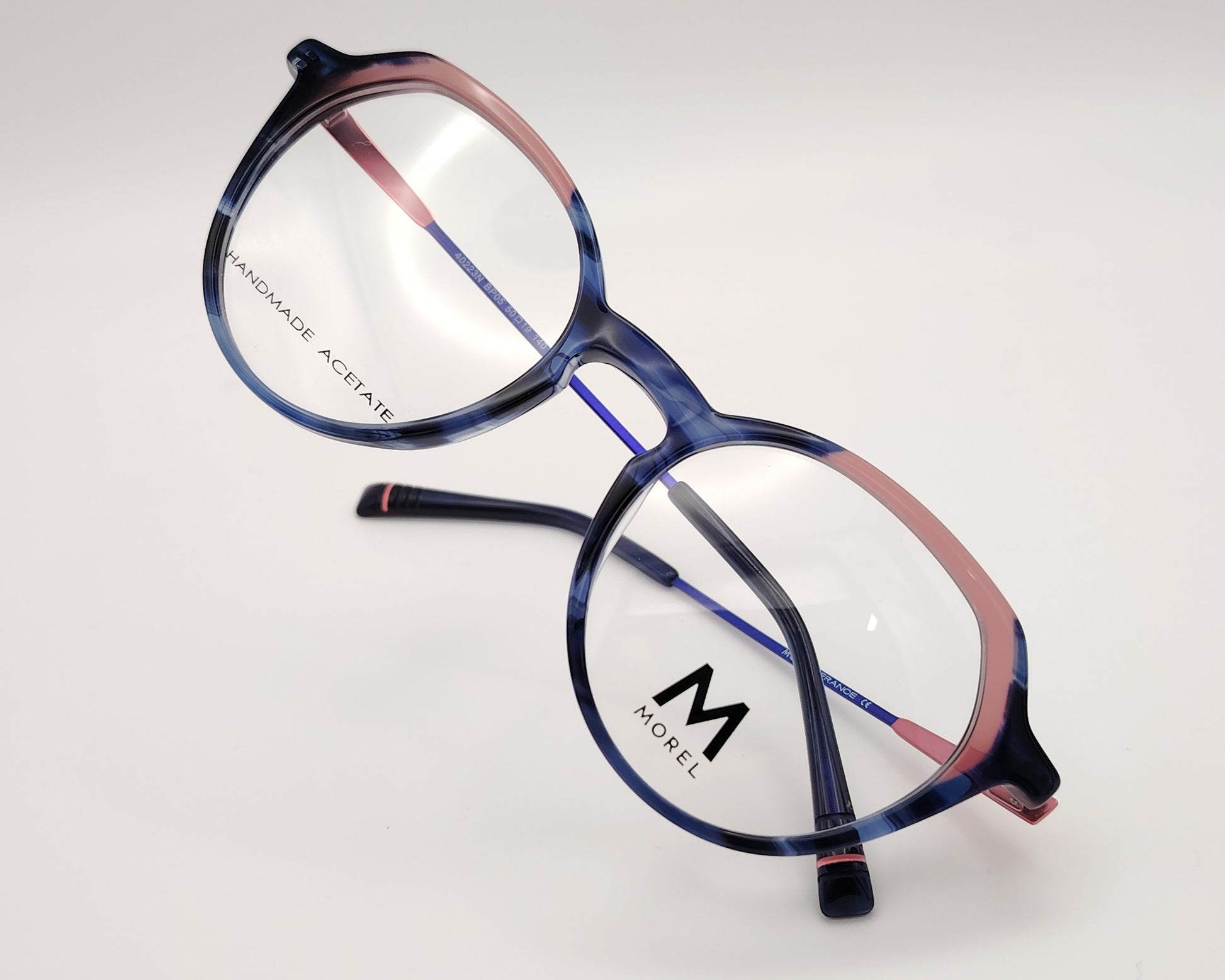 morel 40223n bp05 gafas de vista con montura combinada en acetato y metal diseño en tonos azul y rosa forma redondeada con detalles sofisticados varillas metálicas ligeras para un ajuste cómodo