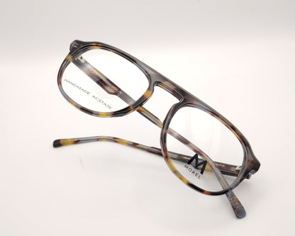 gafas de vista morel nomad con montura redondeada de acetato jaspeado en tonos marrón, gris y mostaza 