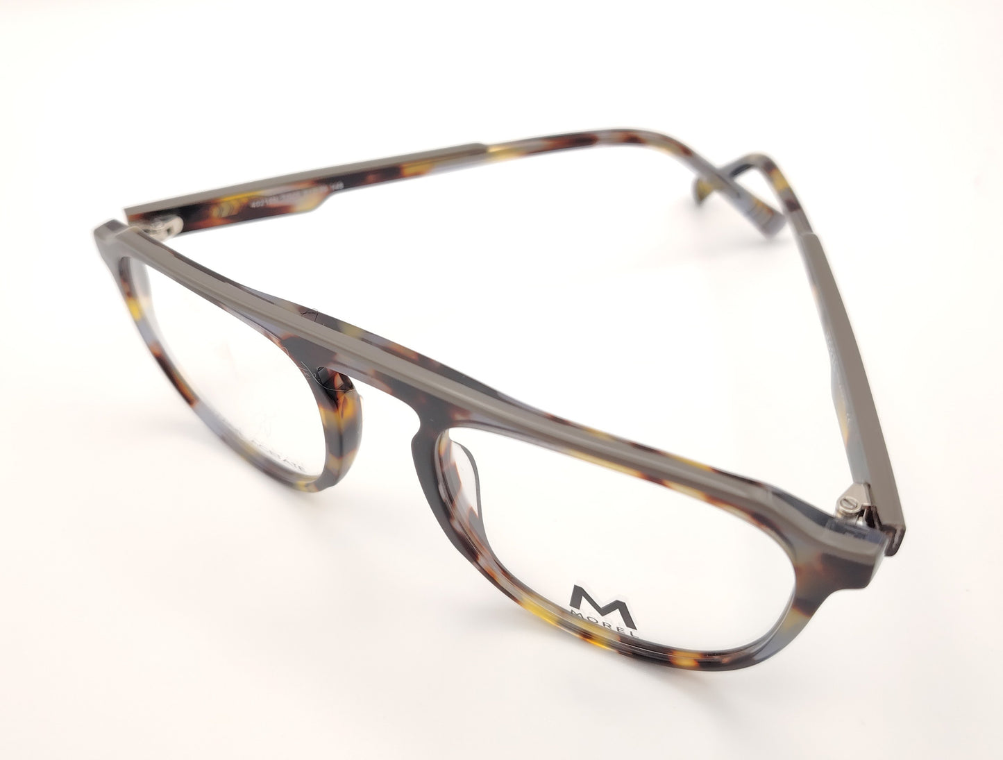 gafas de vista morel nomad con montura redondeada de acetato jaspeado en tonos marrón, gris y mostaza 