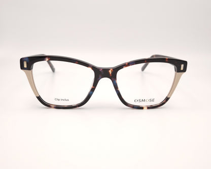 gafas de carey con detalles claros y dos clips solares, uno marrón y otro azul degradado