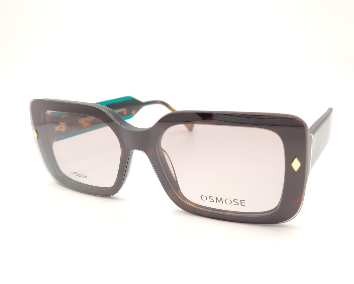gafas de pasta en color carey con detalles en verde y dos clips solares polarizados