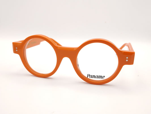 gafas redondas de acetato naranja con detalle dorado en la patilla y frontal grueso