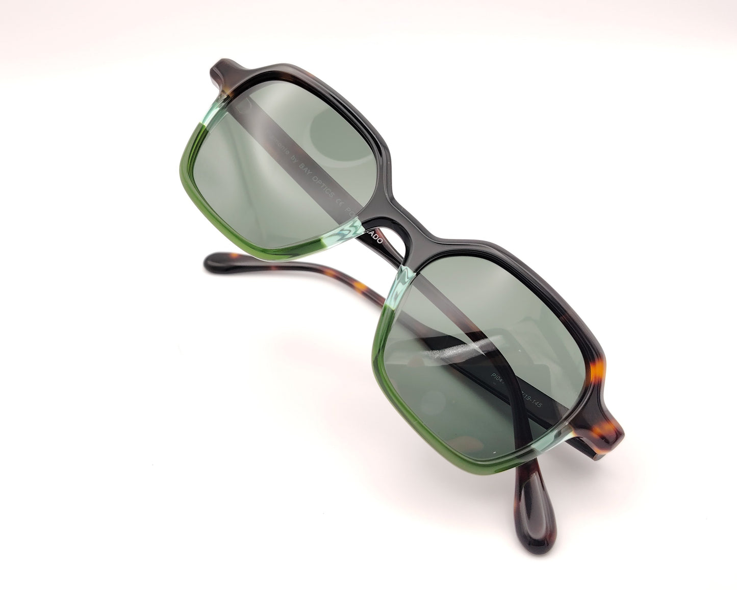 gafas de sol acetato negro carey y verde con lentes polarizadas forma suave
