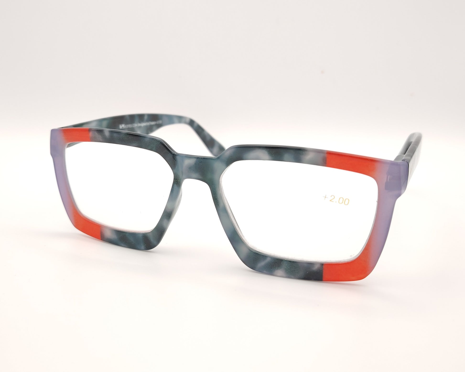 gafas de lectura rectangulares en gris azulado jaspeado con detalles rojo y lila en las esquinas