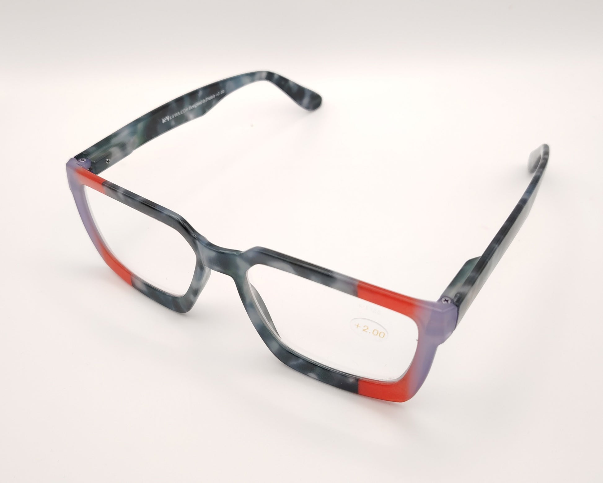 gafas de lectura rectangulares en gris azulado jaspeado con detalles rojo y lila en las esquinas
